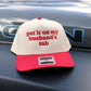 Funny embroidered trucker hat that says put it on my husband's tab with red embroidery and red bill
